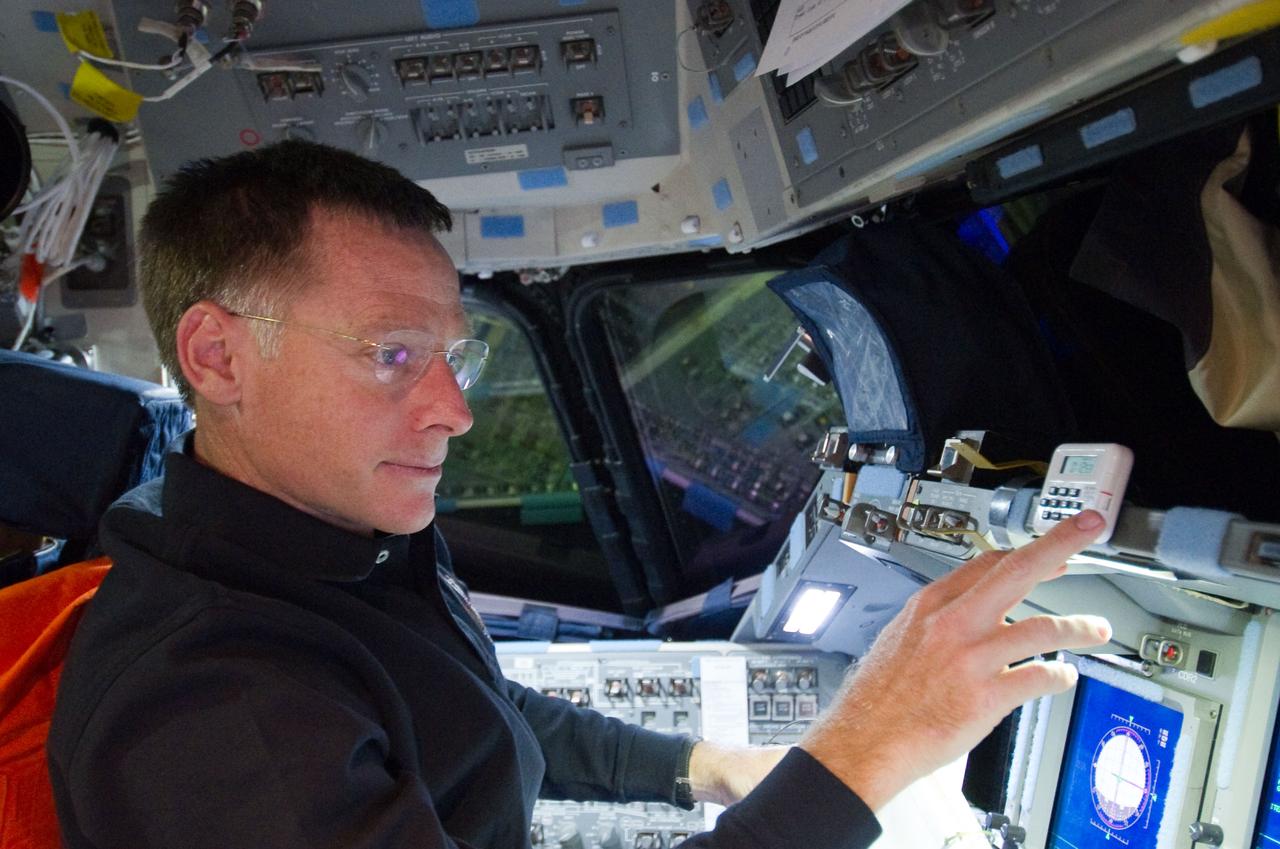 S135-E-007091 (10 July 2011) ? Astronaut Chris Ferguson, STS-135 commander, is pictured at the commander's station on the forward flight deck of the space shuttle Atlantis during the mission?s third day in space. The photo was made shortly before the shuttle and the International Space Station docked. Photo credit: NASA