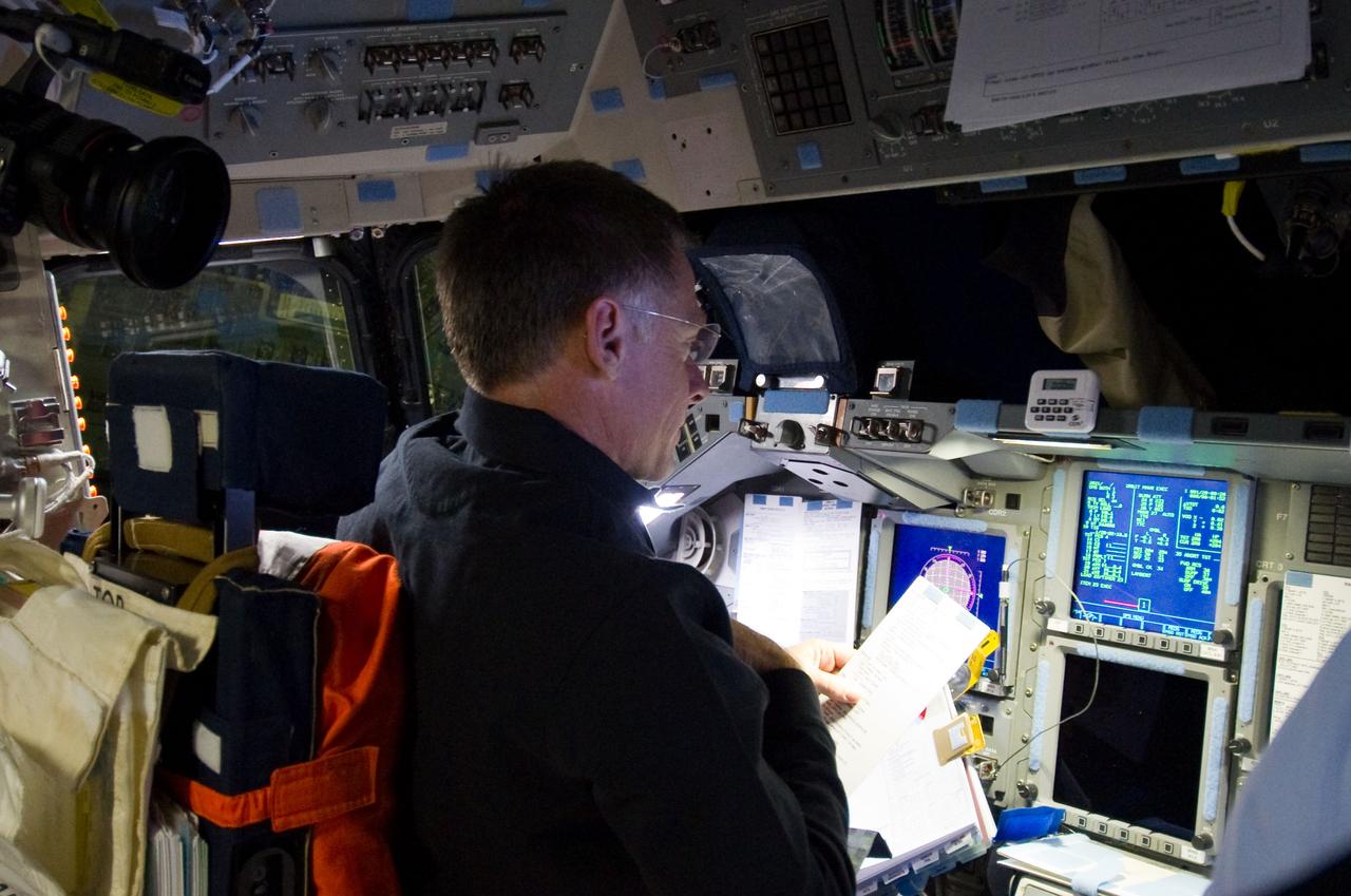 S135-E-007103 (10 July 2011) ? Astronaut Chris Ferguson, STS-135 commander, is pictured at the commander's station on the forward flight deck of the space shuttle Atlantis during the mission?s third day in space. The photo was made shortly before the shuttle and the International Space Station docked. Photo credit: NASA