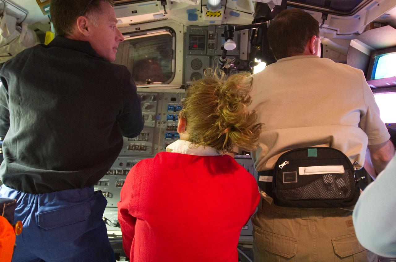 S135-E-007284 (10 July 2011) – From left, NASA astronauts Chris Ferguson, Sandy Magnus and Rex Walheim are pictured on the flight deck of the space shuttle Atlantis during rendezvous and docking operations with the International Space Station. Photo credit: NASA