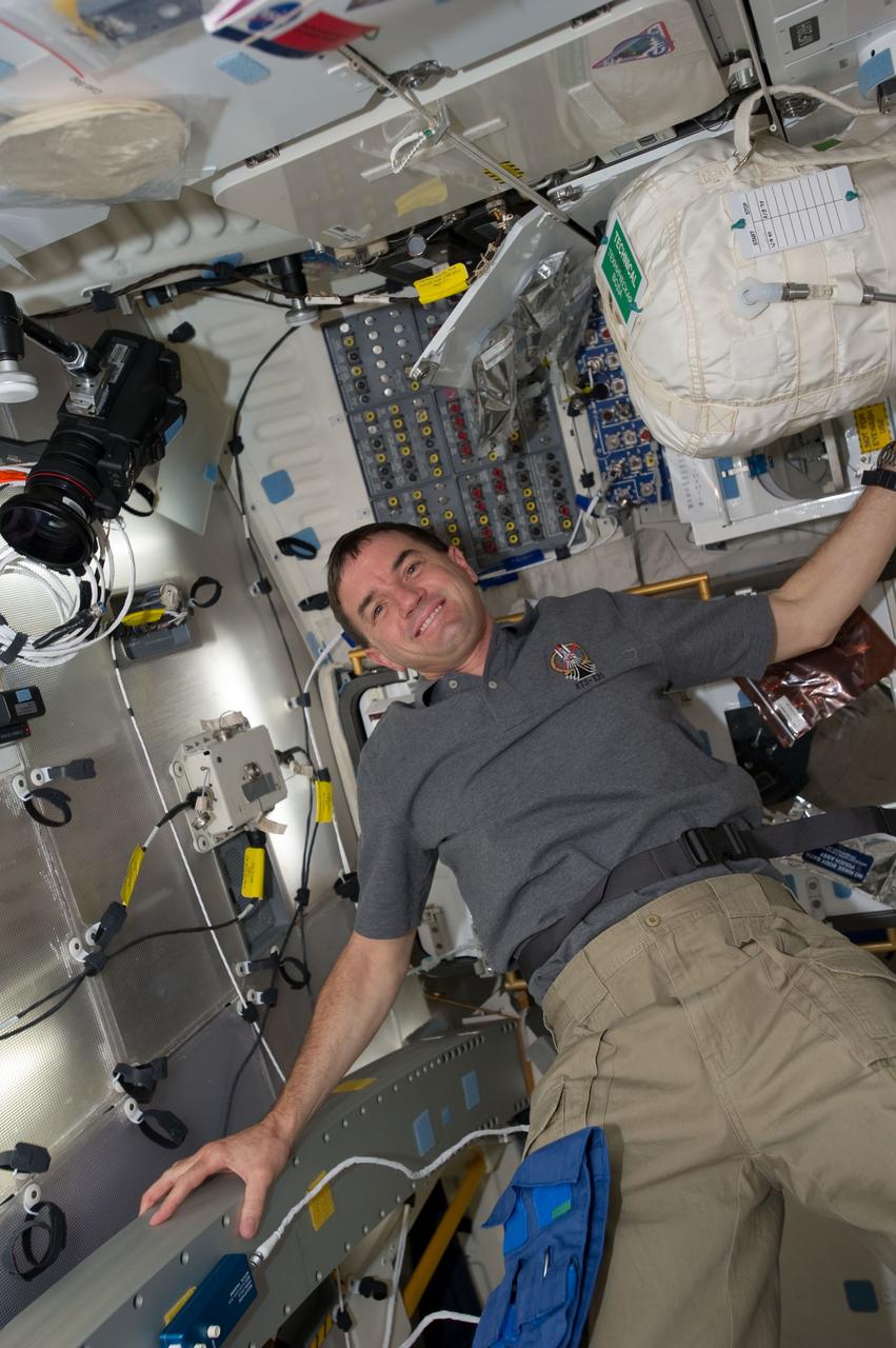 S135-E-007392 (11 July 2011) --- NASA astronaut Rex Walheim, STS-135 mission specialist, is pictured on the middeck of the space shuttle Atlantis during the mission's fourth day in space and second day docked with the International Space Station. Photo credit: NASA