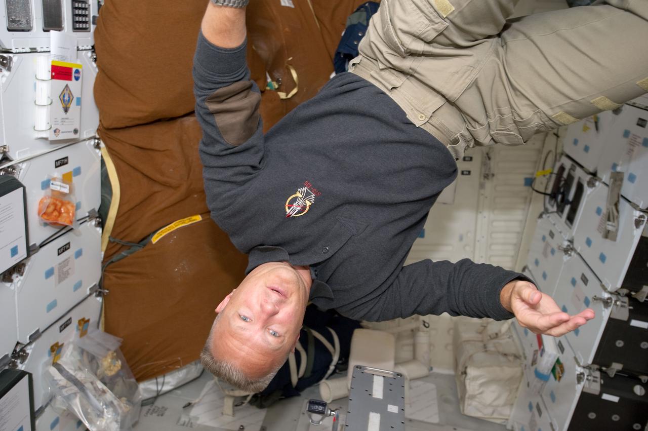 S135-E-007397 (11 July 2011) --- NASA astronaut Doug Hurley, STS-135 pilot, is pictured on the middeck of the space shuttle Atlantis during the mission's fourth day in space and second day docked with the International Space Station. Photo credit: NASA