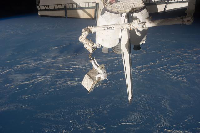 NASA image: Garan transfers Pump Module during EVA 1