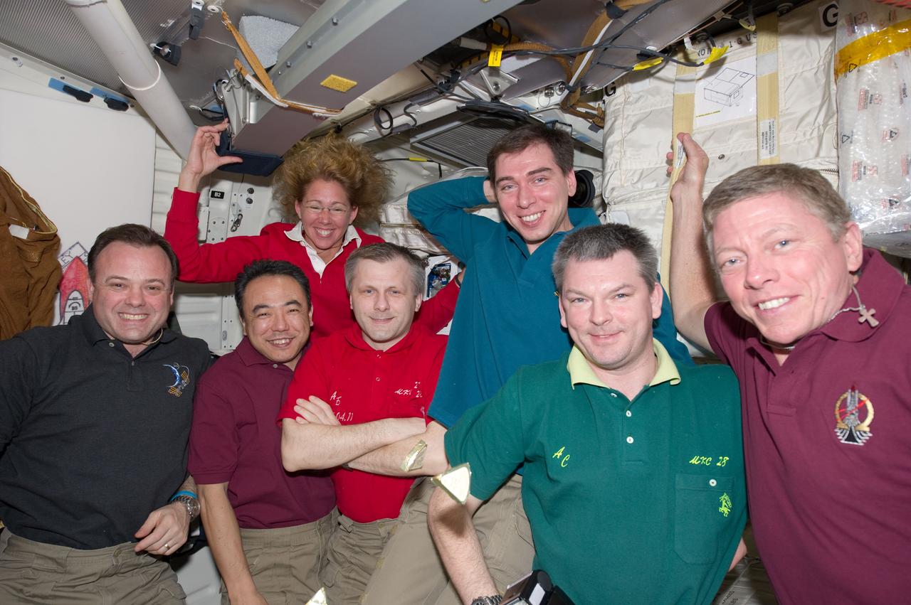 S135-E-007815 (14 July 2011) --- Part of an aggregate of seven  astronauts ? six from NASA and one from the Japan Aerospace Exploration Agency (JAXA) ? and three Russian  cosmonauts prepares to participate on July 14, 2011 in a special meal on the Space Shuttle Atlantis' middeck.  One of the final meals shared between shuttle and station crews has been called  ?The  All-American Meal.?   The STS-135 crew consists of NASA astronauts Chris Ferguson, Doug Hurley, Sandy Magnus and Rex Walheim; the  Expedition 28 or station crew members are  JAXA astronaut Satoshi Furukawa, NASA astronauts Ron Garan and Mike Fossum, and Russian cosmonauts Andrey  Borisenko, Alexander  Samokutyaev  and  Sergei Volkov.  Not in this frame are Ferguson, Walheim and Hurley.  Photo credit: NASA