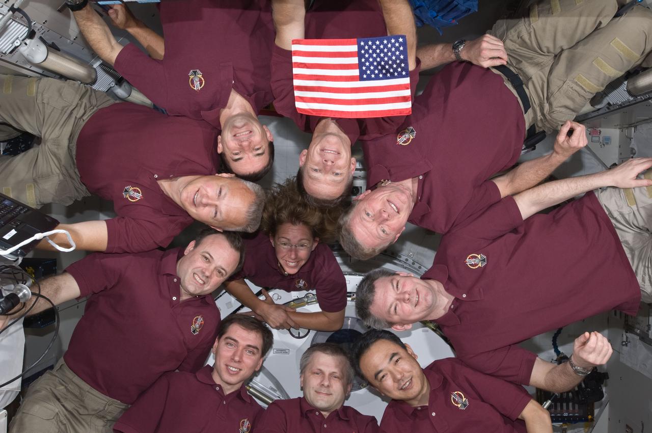 S135-E-008061 (15 July 2011) --- In an occurrence which became somewhat of a tradition for shuttle crews and those of the International Space Station expeditions, the Expedition 28 crew and the STS-135 Atlantis astronauts formed a microgravity circle for a portrait aboard the orbiting complex's Kibo laboratory of the Japan Aerospace Exploration Agency. The STS-135 crew consists of NASA astronauts Chris Ferguson, Doug Hurley, Sandy Magnus and Rex Walheim; the Expedition 28  crewmembers are JAXA astronaut Satoshi Furukawa, NASA astronauts Ron Garan and Mike Fossum, and Russian cosmonauts Andrey Borisenko, Alexander Samokutyaev and Sergei Volkov.  Shuttle and station commanders Ferguson and Borisenko are in the 12 o'clock and six o'clock positions, respectively, on the circle.  The U.S. flag pictured was flown on the first space shuttle mission, STS-1, and flew on this mission to be presented to the space station crew. It will remain onboard until the next crew launched from the U.S. will retrieve it for return to Earth. It will fly from Earth again, with the crew that launches from the U.S. on a journey of exploration beyond Earth orbit.  Photo credit: NASA