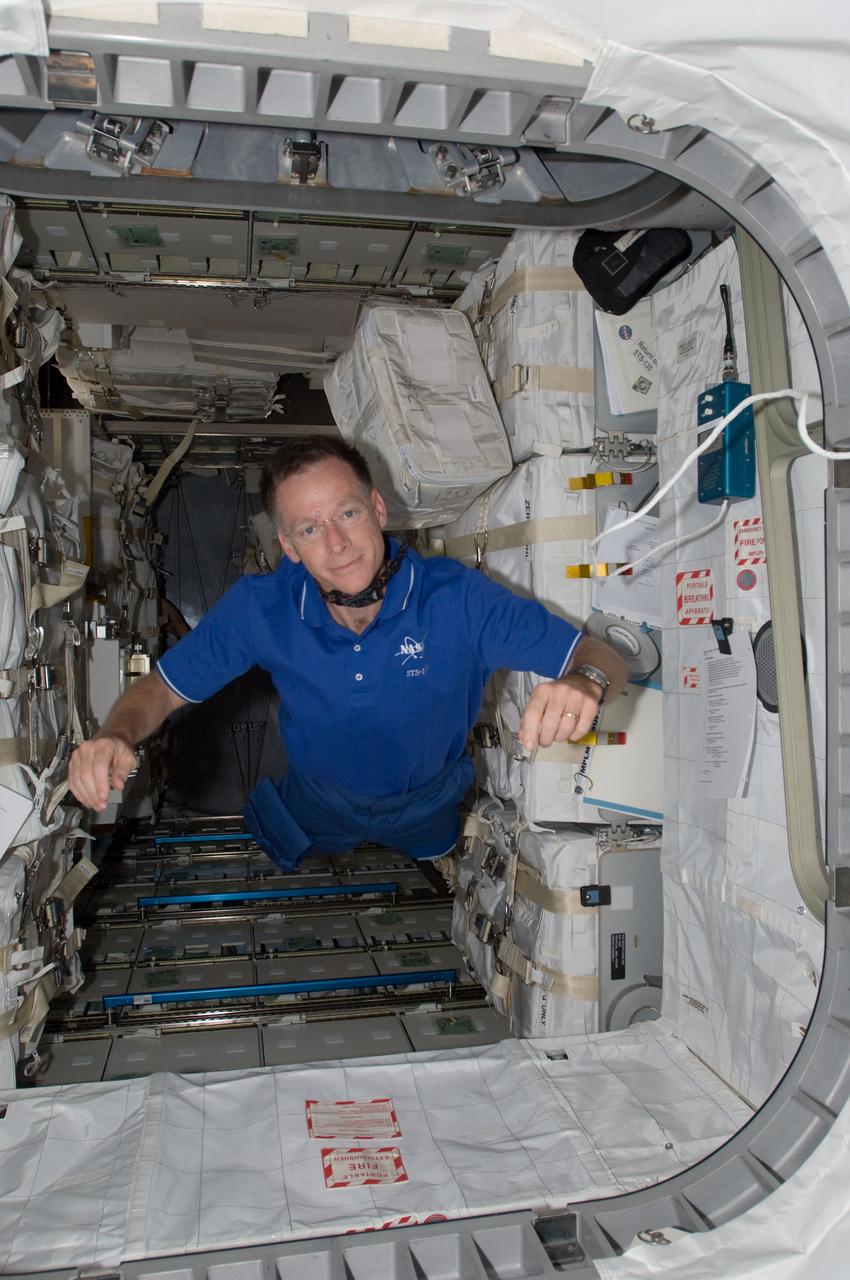 S135-E-008850 (17 July 2011) --- This image shows NASA astronaut Chris Ferguson, STS-135 commander, in the Raffaello multi-purpose logistics module. The photo serves as the "after" shot following a great amount of work by joint crews from Atlantis and the International Space Station to transfer supplies to and from the two spacecraft. Approximately a week earlier Ferguson posed for the "before" version. Photo credit: NASA
