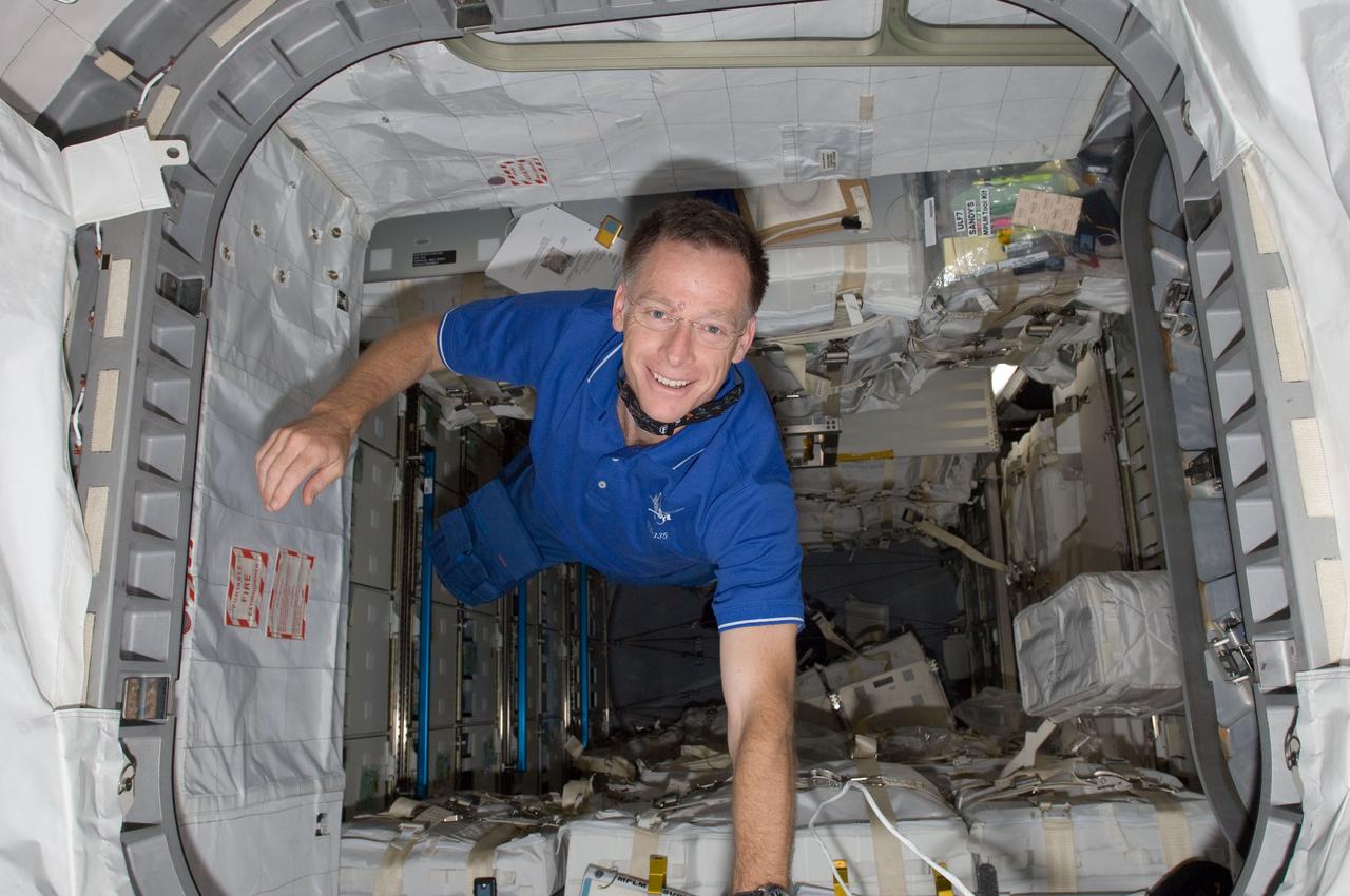 S135-E-008852 (17 July 2011) --- This image shows NASA astronaut Chris Ferguson, STS-135 commander, in the Raffaello multi-purpose logistics module. The photo serves as the "after" shot following a great amount of work by joint crews from Atlantis and the International Space Station to transfer supplies to and from the two spacecraft. Approximately a week earlier Ferguson posed for the "before" version.  Photo credit: NASA