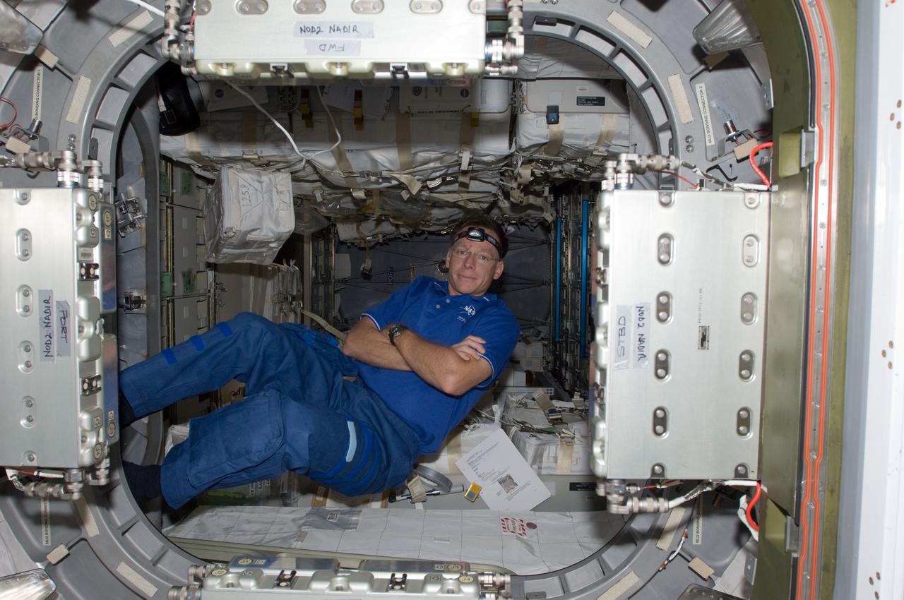 S135-E-008870 (17 July 2011) --- This image shows NASA astronaut Chris Ferguson, STS-135 commander, in the Raffaello multi-purpose logistics module. The photo serves as the "after" shot following a great amount of work by joint crews from Atlantis and the International Space Station to transfer supplies to and from the two spacecraft. Approximately a week earlier Ferguson posed for the "before" version.  Photo credit: NASA