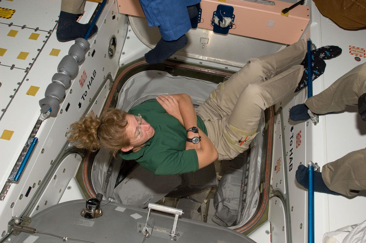 S135-E-009432 (18 July 2011) --- NASA astronaut Sandy Magnus, STS-135 mission specialist, floats in the International Space Station's Node 1 or Unity, with the passageway to the permanent multi-purpose module behind her. She was enjoying some of the last moments onboard the station on the final day of joint activities for the Atlantis and station crews.  Photo credit: NASA