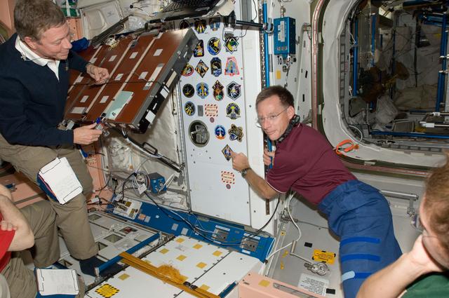 NASA image: Ferguson Places STS-135 Mission Patch in Node 1