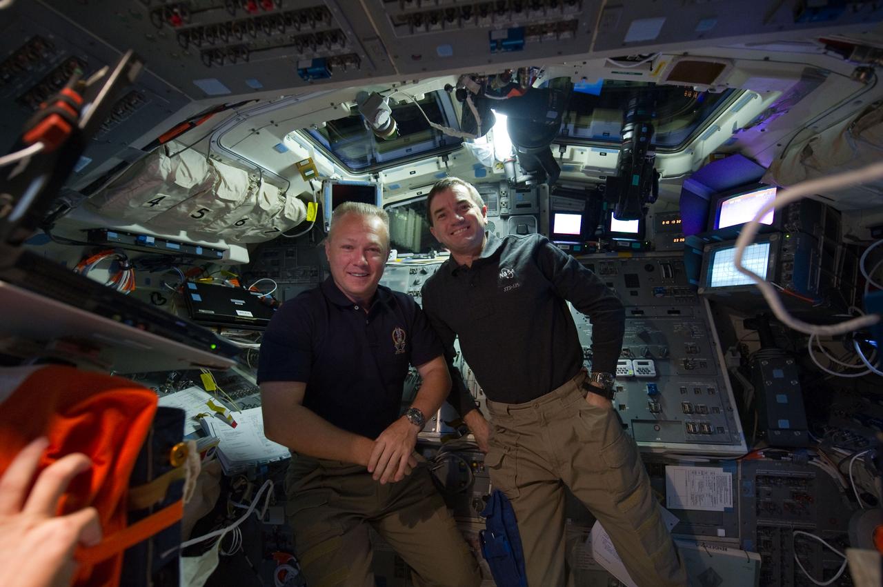 S135-E-010692 (19 July 2011) --- NASA astronauts Doug Hurley (left), pilot for the STS-135 mission and Rex Walheim, mission specialist, are pictured on the flight deck of the space shuttle Atlantis prior to undocking/separation from the International Space Station. Photo credit: NASA