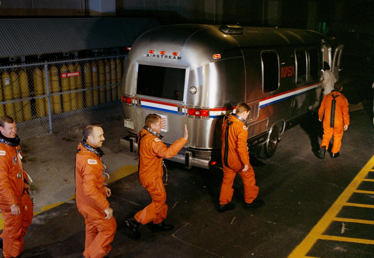 STS028-S-002 (8 Aug 1989) --- The five astronaut crewmembers for STS-28 leave the Operations and Checkout (O&C) Building to board a transfer van en route to Launch Complex 39 for a date with Columbia. Left to right are Astronauts Mark N. Brown, James C. Adamson, David C. Leestma, Richard N. Richards and Brewster H. Shaw Jr.