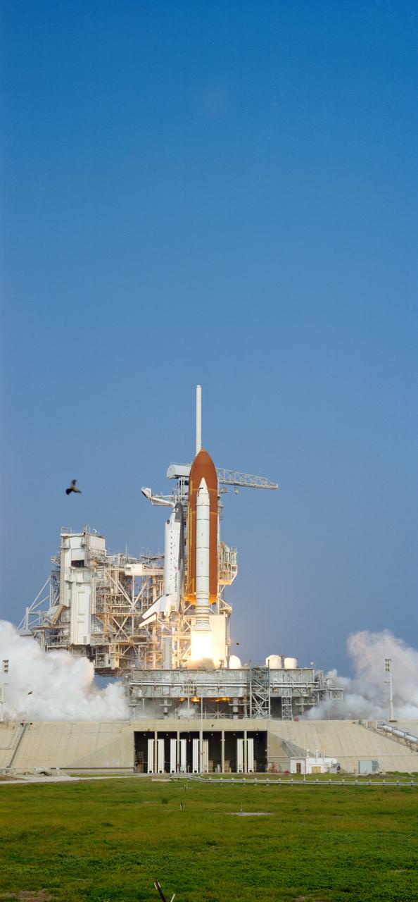 STS028-S-007 (8 Aug 1989) --- Columbia is pictured just prior to clearing the tower at Launch Pad 39-B. The spacecraft renews flight after a period of three and a half years, this time with five crewmembers aboard for STS-28. Onboard the spacecraft are Astronauts Brewster H. Shaw Jr., Richard N. Richards, David C. Leestma, James C. Adamson and Mark N. Brown. The last time Columbia was in space was in January of 1986.