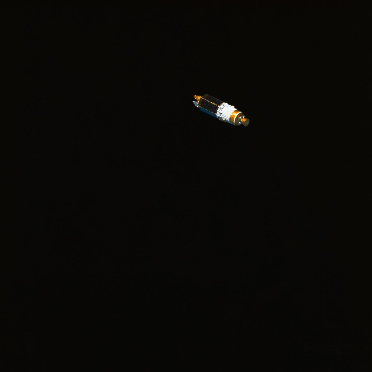STS029-78-019 (13 March 1989) --- Headed on its way to a much higher orbit is another Tracking and Data Relay Satellite (TDRS-D), as photographed with a 70mm camera from inside Discovery's cabin. Moments earlier, the STS-29 crewmembers released the cylindrical form into space from Discovery's cargo bay. When at its final destination high above Earth, TDRS-D will no longer maintain its cylindrical form, having transformed into an operational satellite with antenna spanned out in various directions and its Interim Upper Stage (IUS), covered with gold foil and forward-most in this frame, discarded.