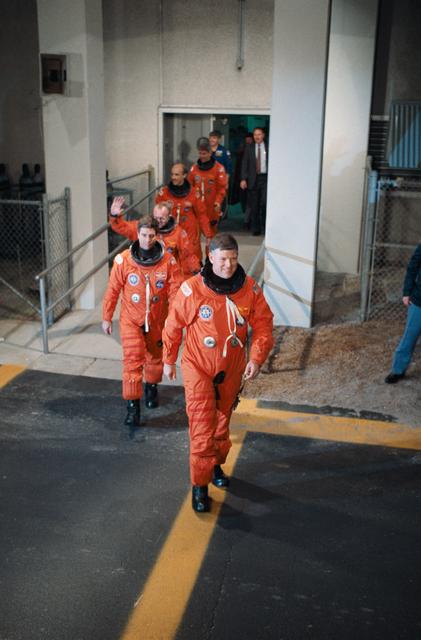 NASA image: STS-29 crewmembers leave KSC Operations and Checkout (O&C) Building