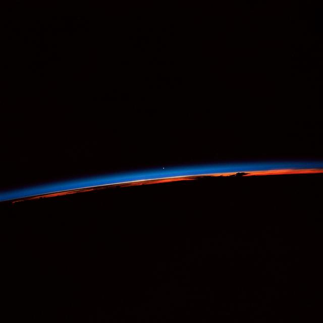 NASA image: STS-30 sunset with Venus near the center of the frame