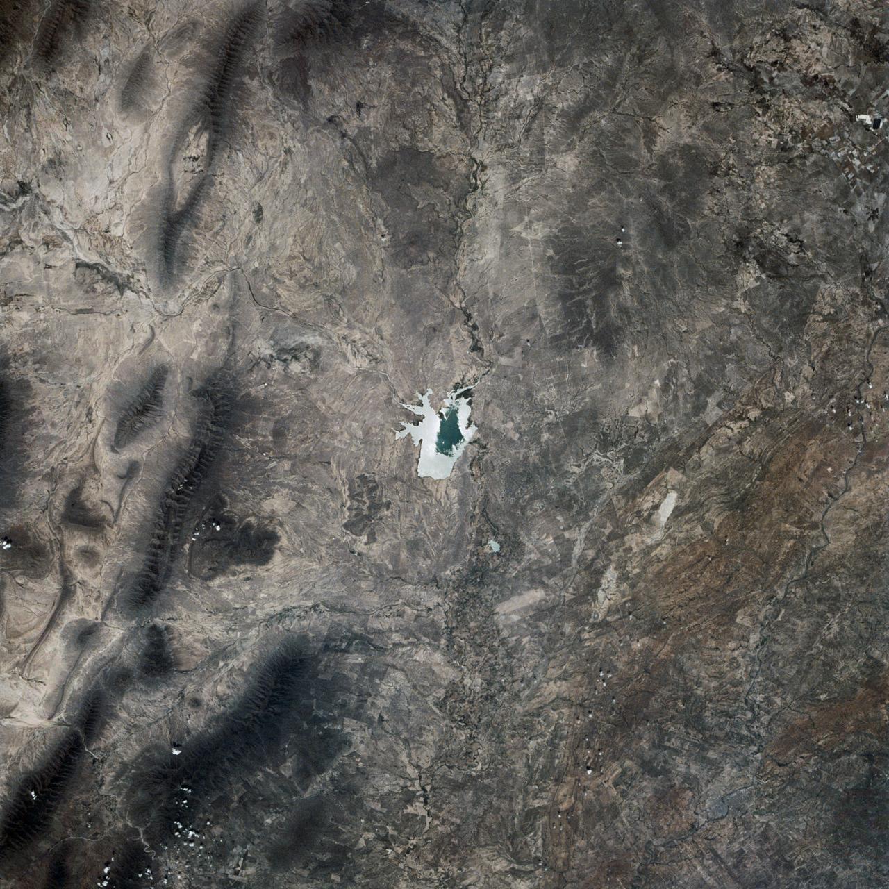 This is a single scene from a pair (frames 021 & 024) to study the effects of polarized light in Earth Observations. One scene was exposed with vertically polarized light, the other, horizontally. The subject in this study, is a lake behind Presa (dam) Don Martin (27.5N, 100.5W) on the edge of the Rio Grande Plain near it's boundry with the Sierra Madre Orientral in Coahuila, Mexico.