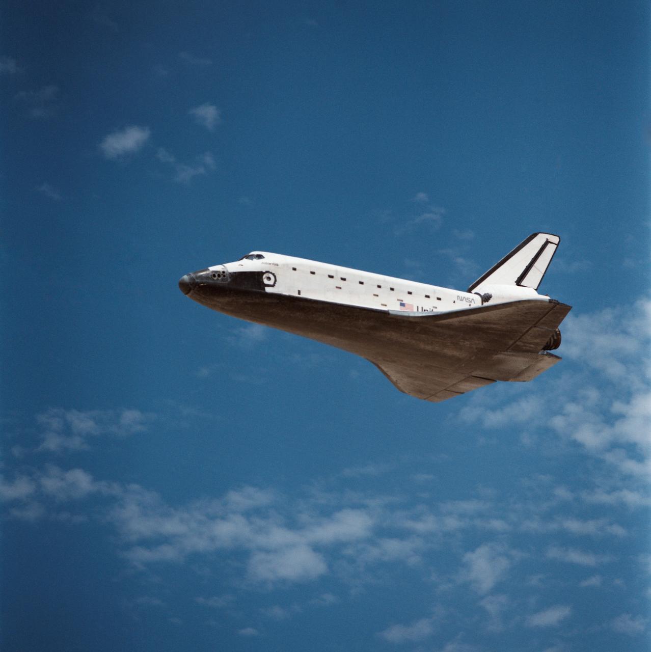 STS030-S-127 (8 May 1989) --- The space shuttle Atlantis, as seen in a low angle view on its glide in from Earth orbit, heads toward a concrete runway at Edwards Air Force Base in California. Onboard were astronauts David M. Walker, STS-30 commander; Ronald J. Grabe, pilot; and astronauts Norman E. Thagard, Mary L. Cleave and Mark C.  Lee ? all mission specialists.  Photo credit: NASA