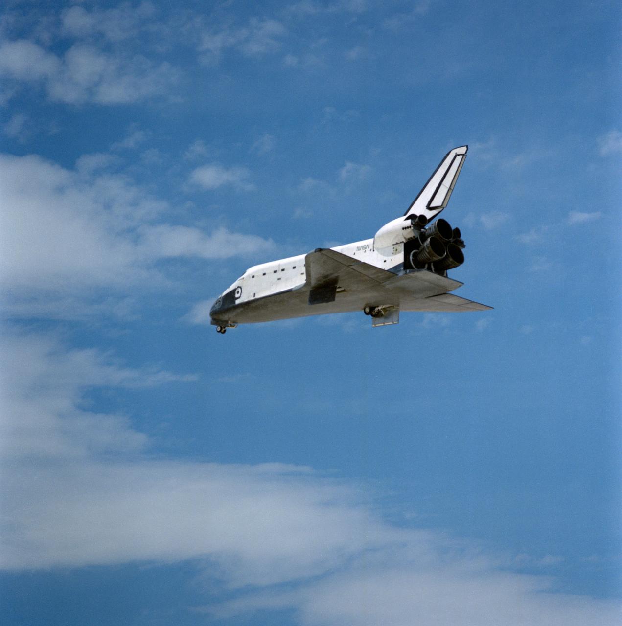 STS030-S-128 (8 May 1989) --- Space Shuttle Atlantis? landing gear has just appeared and the spacecraft, with five astronaut crewmembers aboard, heads for a smooth landing on runway 22 at Edwards Air Force Base in southern California.  Onboard the spacecraft were astronauts David M. Walker, Ronald J. Grabe, Norman E. Thagard, Mary L. Cleave and Mark C. Lee.  The crew spend just over four full days in space, having released the Magellan spacecraft toward Venus on the first day.