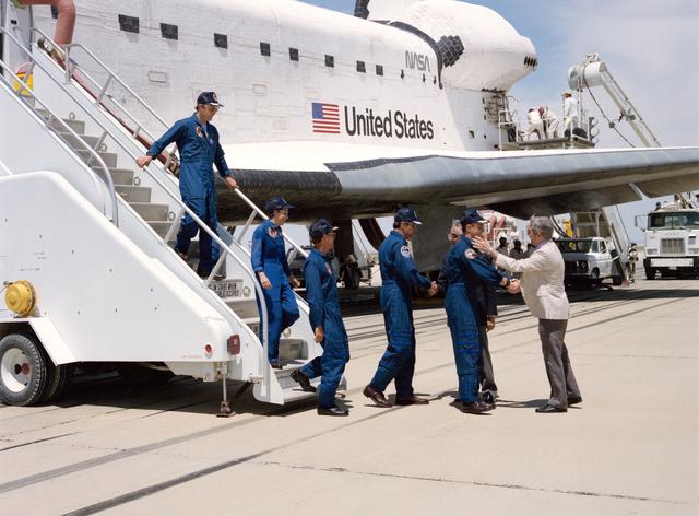 NASA image: STS-30 crew egressing OV-104 is greeted by NASA administrators at EAFB