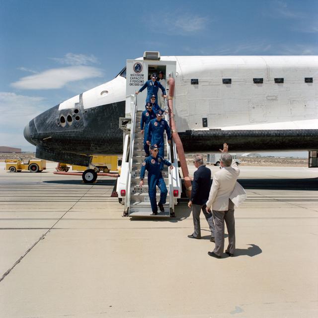 NASA image: STS-30 crew egresses OV-104 via stairway at Edwards Air Force Base (EAFB)