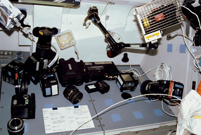 NASA image: STS-31 camera & photographic equipment displayed on OV-103's aft flight deck