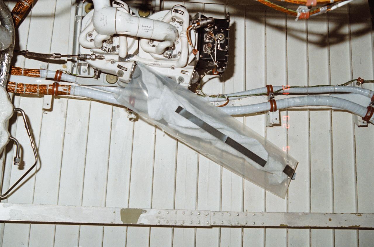 During STS-32, onboard Columbia, Orbiter Vehicle (OV) 102, a leakage problem at environmental control and life support system (ECLSS) air revitalization system (ARS) humidity separator A below the middeck is solved with a plastic bag and a towel. The towel inserted inside a plastic bag absorbed the water that had collected at the separator inlet.