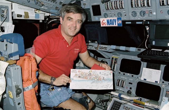 NASA image: STS-32 Commander Brandenstein displays birthday card on OV-102's flight deck