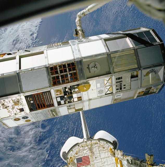 NASA image: LDEF grappled and positioned by RMS over OV-102's payload bay during STS-32