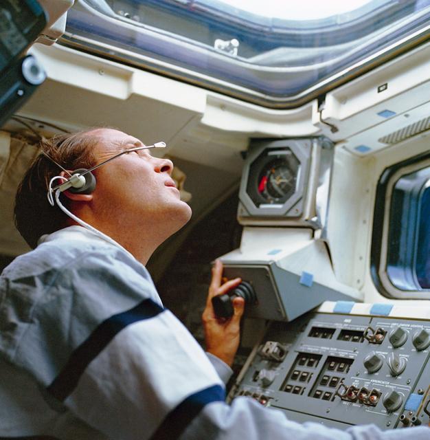 NASA image: STS-33 MS Carter operates translation hand control (THC) on aft flight deck