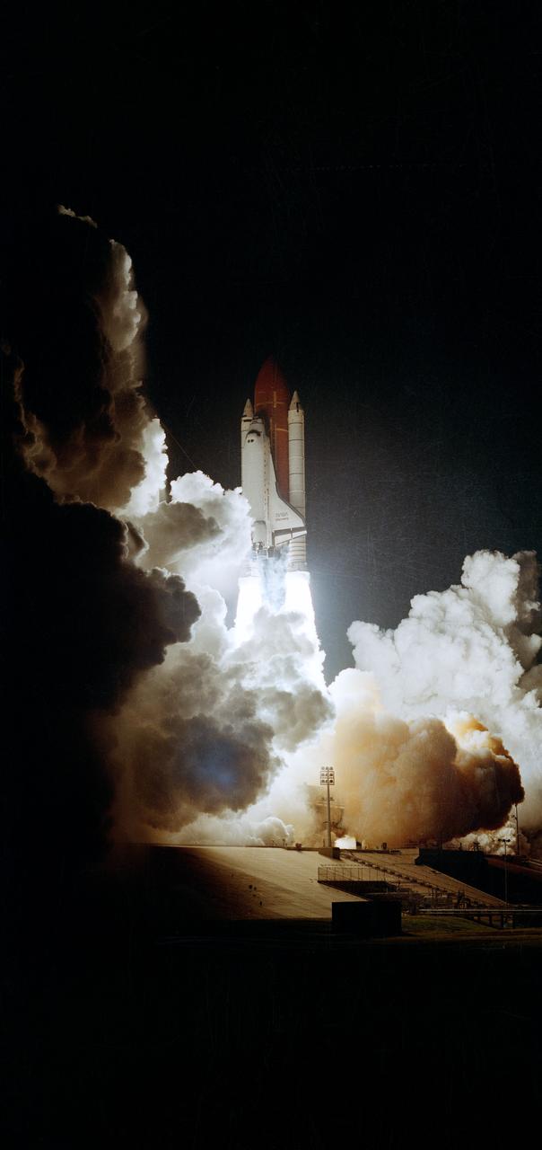 STS033-S-003 (22 Nov 1989) --- The Space Shuttle Discovery heads for Earth-orbit on the first post-Challenger nocturnal launch.  Liftoff occurred at 7:23:29:989 p.m. (EST), November 22, 1989.  This picture shows almost a full front view of the Space Shuttle Discovery, its two Solid Rocket Boosters (SRB) and the External Tank (ET).  Onboard for the Department of the Defense (DOD) devoted mission were astronauts Frederick D. Gregory, John E. Blaha, F. Story Musgrave, Kathryn C. Thornton and Manley L. Carter.