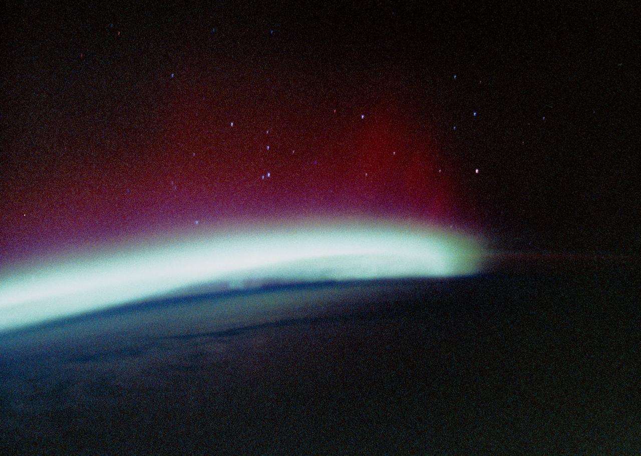 STS034-44-023 (20 Oct. 1989) --- The Southern Lights or Aurora Australis were photographed by the STS-34 crewmembers aboard the Earth-orbiting Space Shuttle Atlantis.  From the Shuttle astronauts can photograph expanses of auroras, an advantage over scientists on Earth who can only get small sections at a time in a frame of photography.  The space position allows for large-scale changes.   This scene was one of 26 shown to the press by the five STS-34 crewmembers at their post-flight press conference.