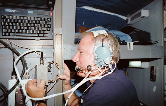 NASA image: STS-35 Commander Brand talks to family using SAREX on OV-102's middeck