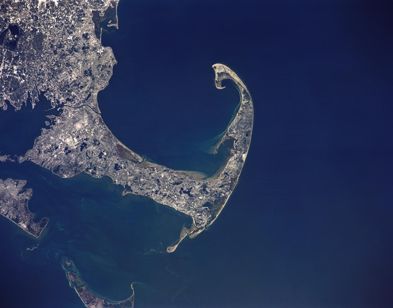 STS036-151-225 (2 March 1990) --- Surrounded by waters of the Atlantic Ocean, Cape Cod Bay and Nantucket Sound, the jutting Cape Cod feature caught the attention of the astronaut crewmembers aboard the Earth-orbiting Space Shuttle Atlantis, 126 nautical miles above Earth. Parts of Martha's Vineyard and Nantucket are in bottom left corner. Plymouth Bay is in upper left corner. Center point coordinates are 42 degrees north latitude and 70 degrees west longitude. A large format Linhof camera (4" x 5" film) was used to expose the frame.