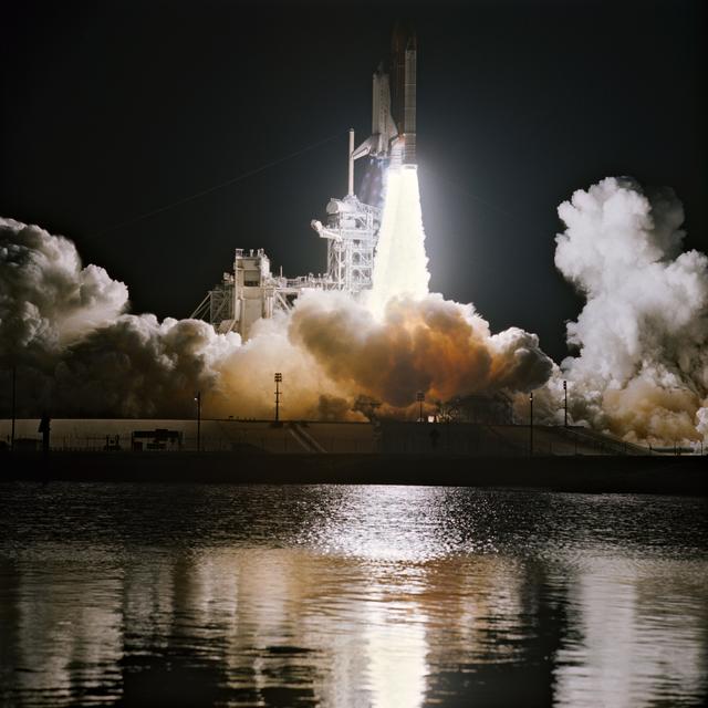 NASA image: STS-36 Atlantis, OV-104, lifts off from KSC LC Pad 39A into darkness