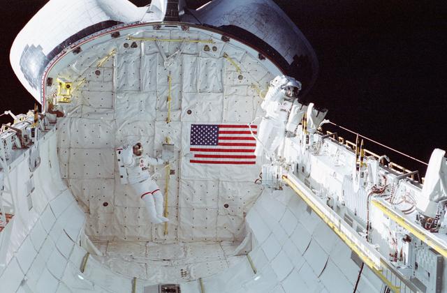 NASA image: STS-37 EVA astronauts in PLB wave to fellow crewmembers in crew compartment