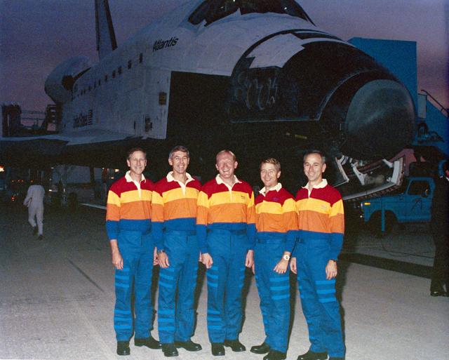 NASA image: STS-38 crew poses in front of OV-104 at KSC's SLF during post flight activity