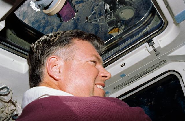 NASA image: STS-39 Commander Coats on OV-103's flight deck watches SPAS-II/IBSS deploy