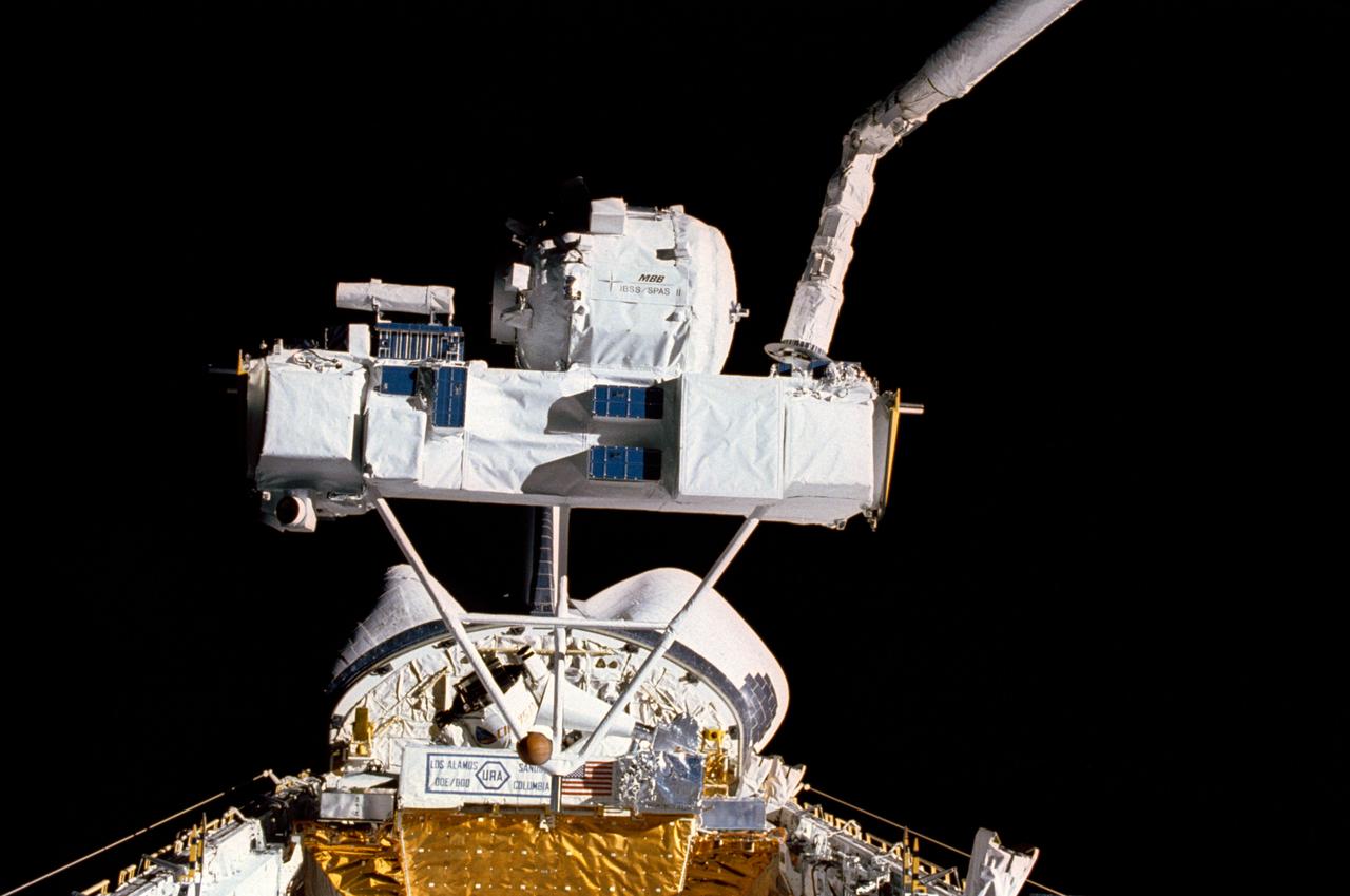 STS039-15-017 (3 May 1990) --- This STS-39 35mm scene shows the Strategic Defense Initiative Organization (SDIO) Shuttle Pallet Satellite (SPAS-II) during its berthing following a period of data collection.  During the eight-day flight, SPAS collected data in both a free-flying mode and while attached to the end effector of Discovery's remote manipulator system (RMS).  Additional cargo, elements of the Air Force Program (AFP) 675 package, is seen near Discovery's aft bulkhead in the 60-ft. long payload bay.