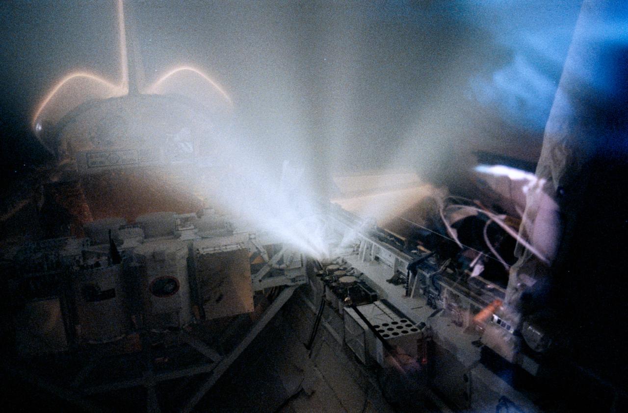 STS039-367-006 (1 May 1991) --- One of the four compressed gas canisters on the forward port side of Discovery's cargo bay releases gas on flight day 4 of the STS-39 mission.  The canisters are part of STS-39's Critical Ionization Velocity (CIV) experiment.