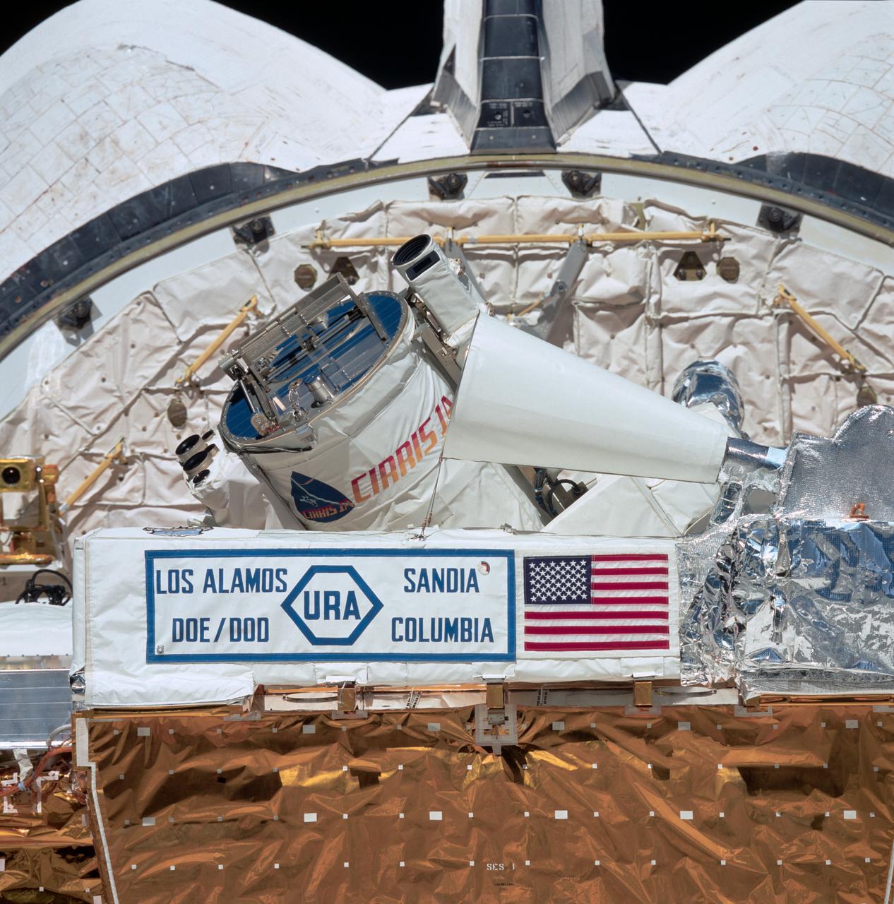 STS039-85-073 (28 April- 6 May 1991) --- This 70mm frame, taken from inside the crew cabin, shows a close-up view of the Air Force Program (AFP) 675 package.  AFP-675 consists of the Cryogenic Infrared Radiance Instrumentation for Shuttle (CIRRIS)-1A; Far Ultraviolet Camera (FAR-UV) Experiment; Horizon Ultraviolet Program (HUP); Quadruple Ion Neutral Mass Spectrometer (QINMS); and the Uniformly Redundant Array (URA).  Much of that hardware is backdropped here against the aft cargo bay bulkhead of Discovery.