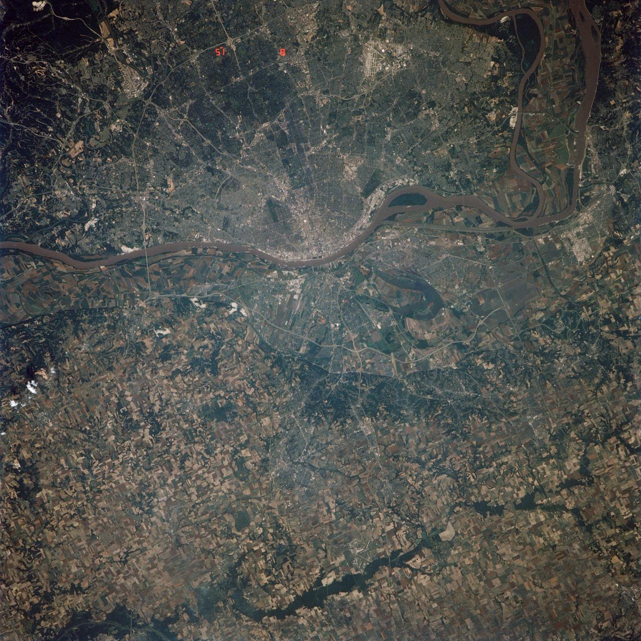 STS040-614-066 (5-14 June 1991) --- St. Louis, Missouri-East St. Louis, Illinois and surrounding area were photographed by the STS 40 crewmembers aboard the Space Shuttle Columbia.  The winding Mississippi River serves as a reference point for finding features of the area.  Busch Stadium is clearly seen.  NASA photo experts studying the STS 40 imagery claim photographs of this type aid in following demographic changes and in planning for development.  The ground track of STS-40 and the existence of exceptionally clear skies during much of the nine-day flight permitted photographic acquisition of several cities not generally seen from the space flights flying at 28-degree inclinations to the Equator.