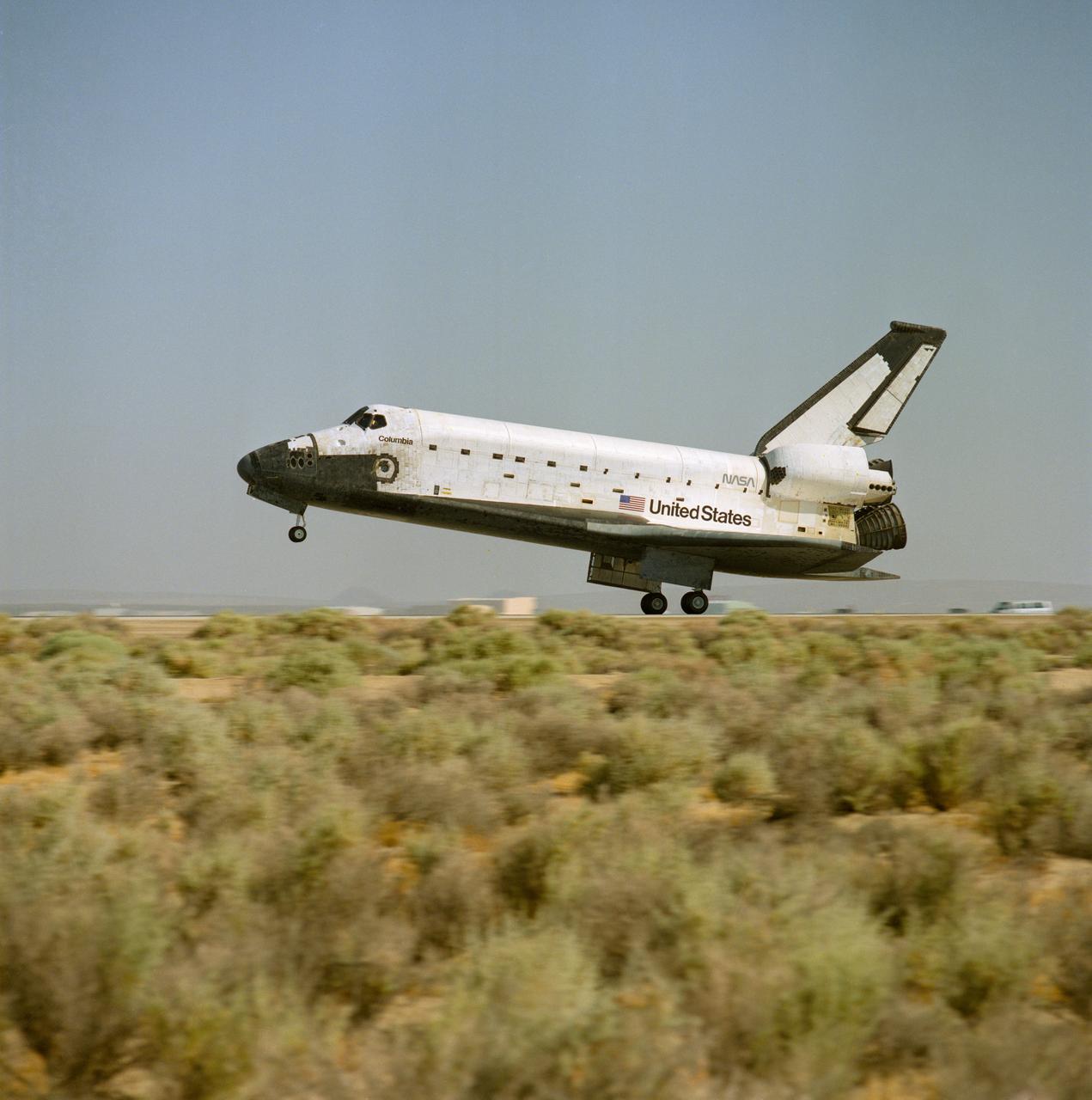 STS040-S-175 (14 June 1991) --- The main landing gear of the Space Shuttle Columbia touches down, on Runway 22 at Edwards Air Force Base in California, to complete a successful nine-day mission.  The Spacelab Life Sciences (SLS-1) mission was the first ever devoted exclusively to life sciences research.  Onboard the spacecraft were astronauts Bryan D. O'Connor, Sidney M. Gutierrez, Rhea Seddon, James P. Bagian and Tamara E. Jernigan; and payload specialists F. Drew Gaffney and Millie Hughes-Fulford.  Landing occurred at 8:39:11 a.m. (PDT), June 14, 1991.
