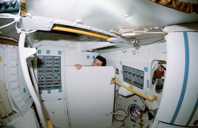 NASA image: STS-41 crewmembers conduct DSO 0472 Intraocular Pressure on OV-103's middeck