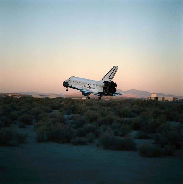NASA image: STS-41 Discovery, OV-103, glides over concrete runway 22 at EAFB, California