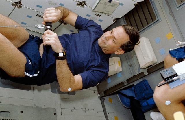 NASA image: STS-42 Commander Grabe uses DTO 653 MK1 Rowing Machine on OV-103's middeck