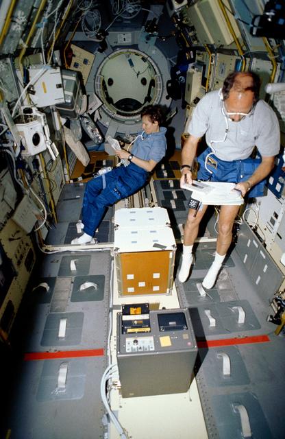 NASA image: STS-42 MS/PLC Thagard and Payload Specialist Bondar work in IML-1 spacelab