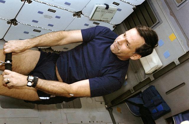 NASA image: STS-42 Commander Grabe uses DTO 653 MK1 Rowing Machine on OV-103's middeck