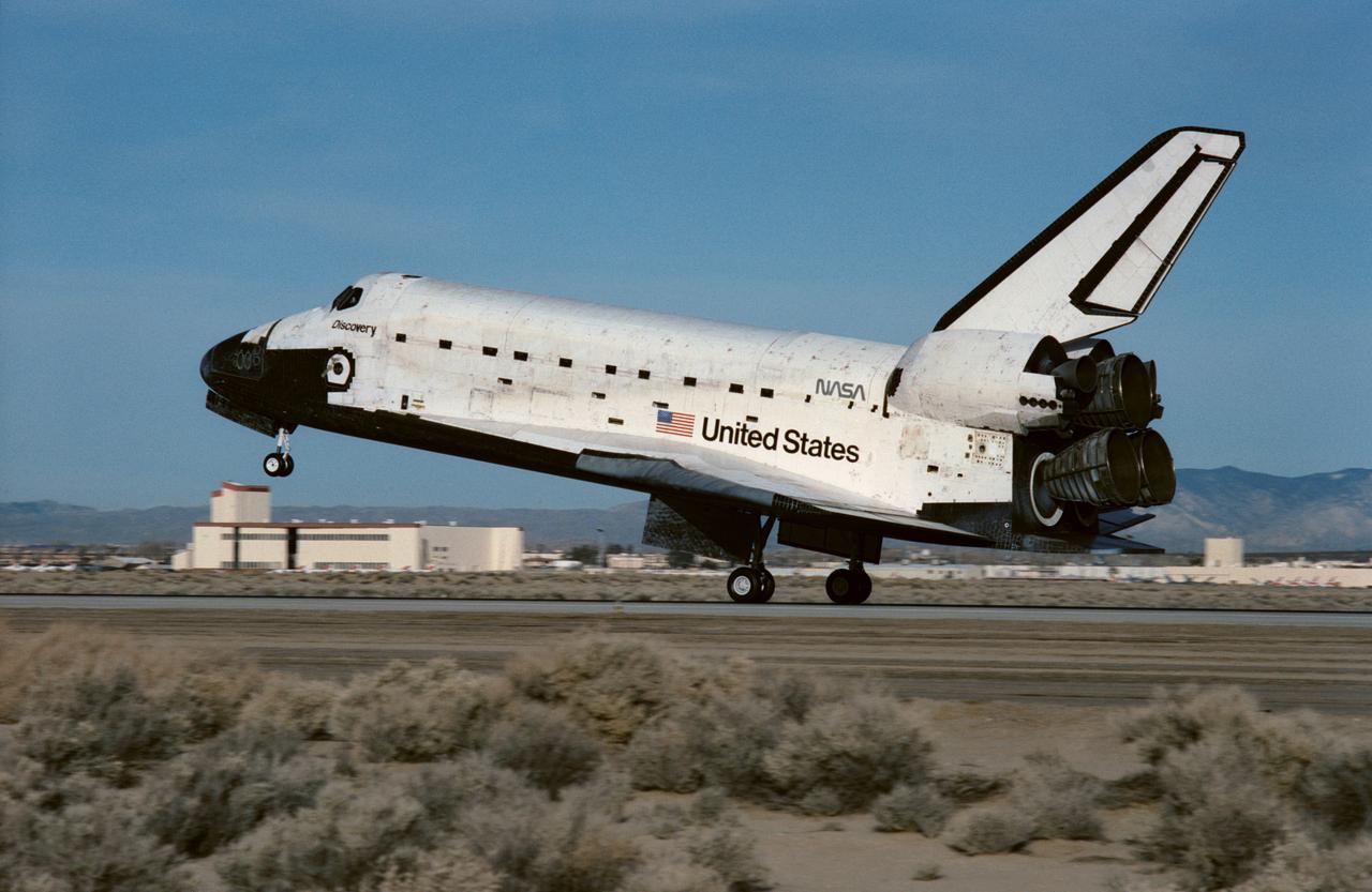 STS042-S-094 (30 Jan 1992) --- Space Shuttle Discovery lands on Runway 22 at Edwards Air Force Base in southern California to complete an eight-day mission.  Main gear touchdown occurred at 8:07:18 a.m. (PST), Jan. 30, 1992.  The crewmembers aboard Discovery for the first International Microgravity Laboratory (IML-1) mission were astronauts Ronald J. Grabe, mission commander;  Stephen S. Oswald, pilot;  Norman E. Thagard, payload commander;  and David C. Hilmers and William F. Readdy, both mission specialists;  and payload specialists Roberta L. Bondar of Canada and Ulf Merbold, representing the European Space Agency (ESA).