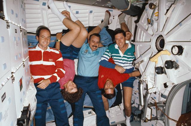 NASA image: STS-43 crewmembers pose for onorbit (in space) portrait on OV-104's middeck