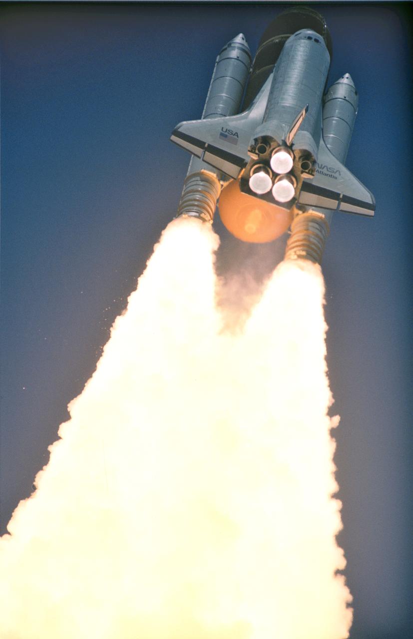 STS043-S-088 (2 Aug 1991) --- A low angle, 35mm view of the Space Shuttle Atlantis as it soars toward space to begin a scheduled nine-day mission. The 11:02:00 a.m. (EDT) liftoff from Launch Pad 39A came at the beginning of the launch window. Onboard the spacecraft were astronauts John E. Blaha, mission commander; Michael A. Baker, pilot; and Shannon W. Lucid, James C. Adamson and G. David Low, all mission specialists. Six hours after this picture was taken, the astronauts deployed the Tracking and Data Relay Satellite (TDRS-E).